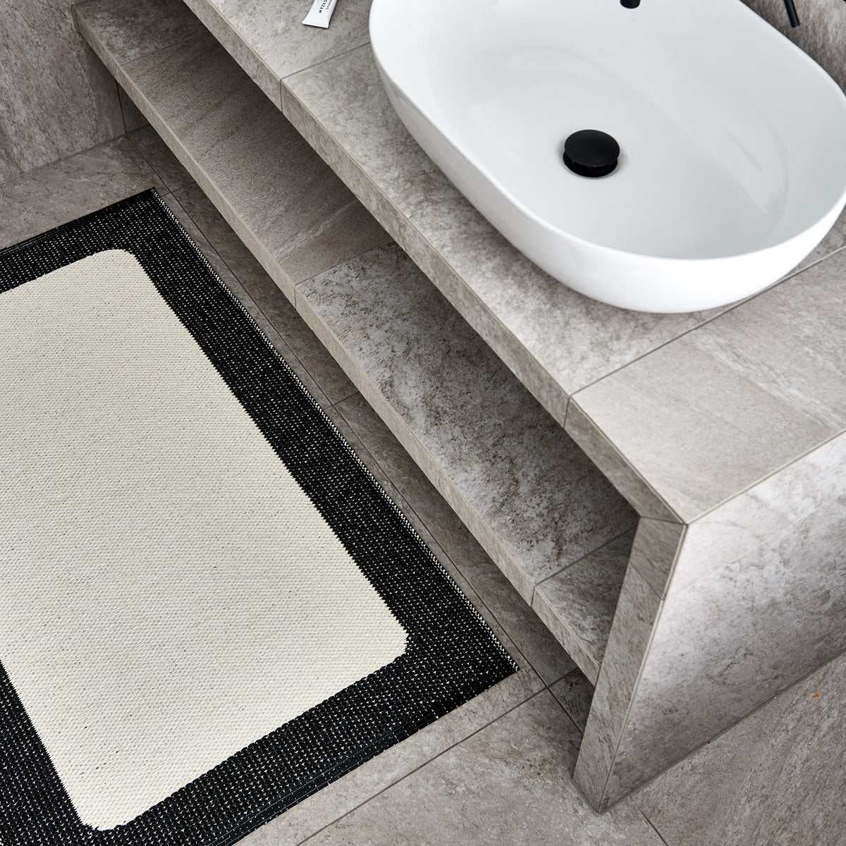 Pappelina Ilda Black -Vanilla Reversible 2.25 x 6 ft Rug